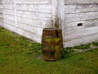 old rainbarrel next to pioneer house