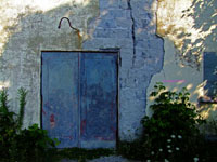 exposed stone wall from abandoned 1930s movie theatre