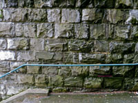 wet stone wall and walkway