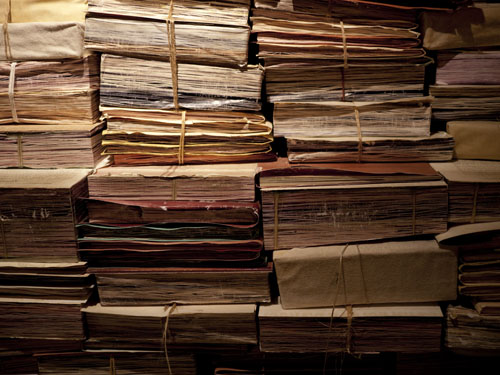 stacks of genealogy records